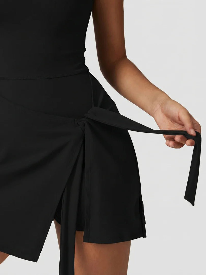 CARYS SLEEVELESS WRAP TENNIS DRESS - Lavesna
